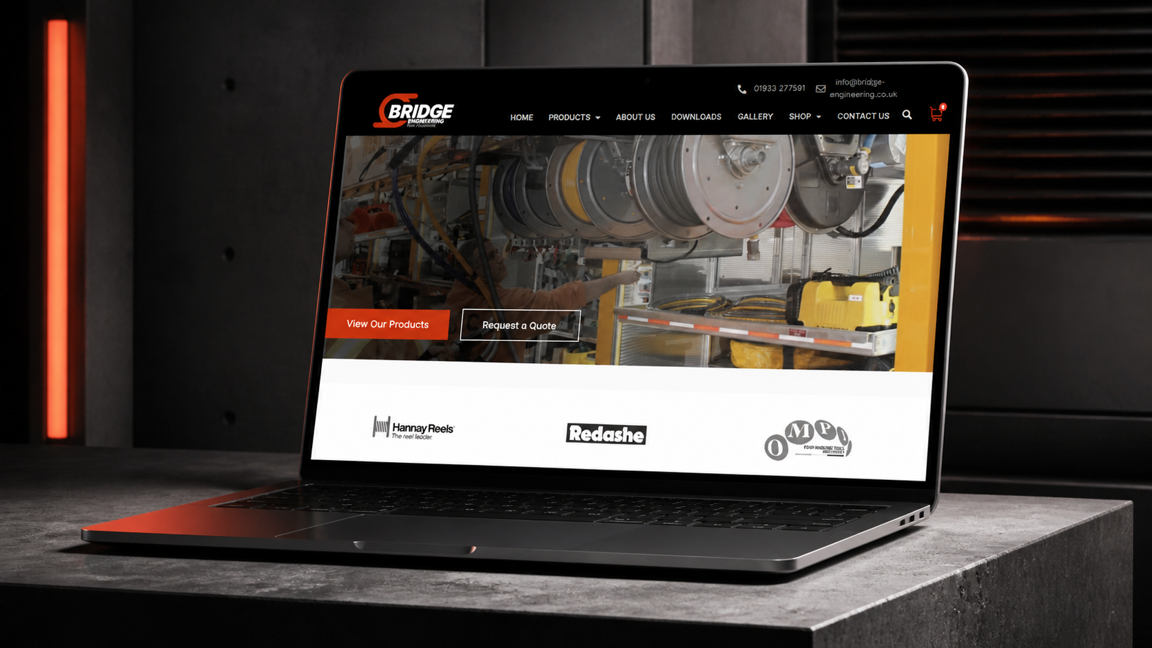 Bridge Engineering homepage presented on a laptop in a styled setting
