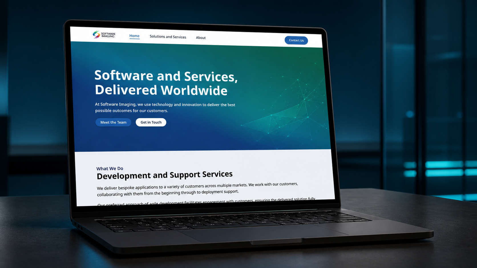 Software Imaging website presented on a laptop in a styled setting